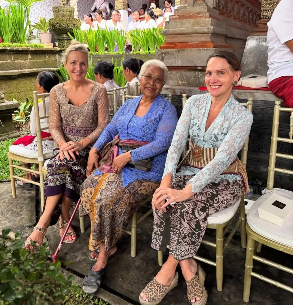 Janet De Neefe sharing a moment with Balinese women in traditional community gathering.