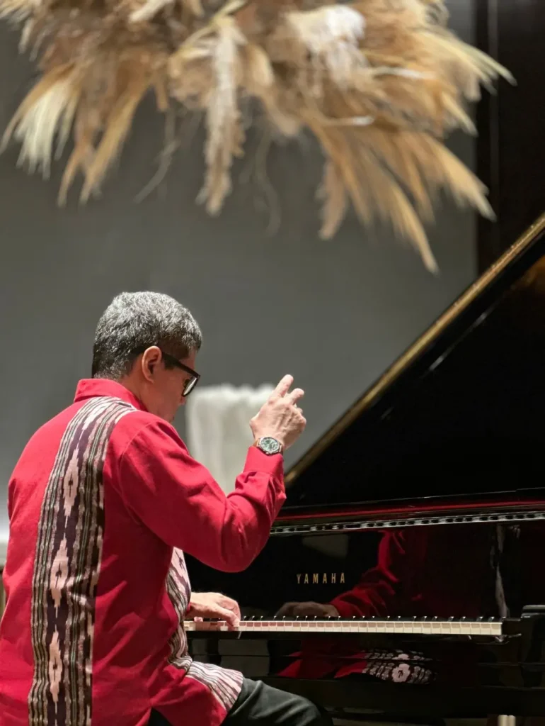 Ananda Sukarlan performing a classical piano recital before a live audience.