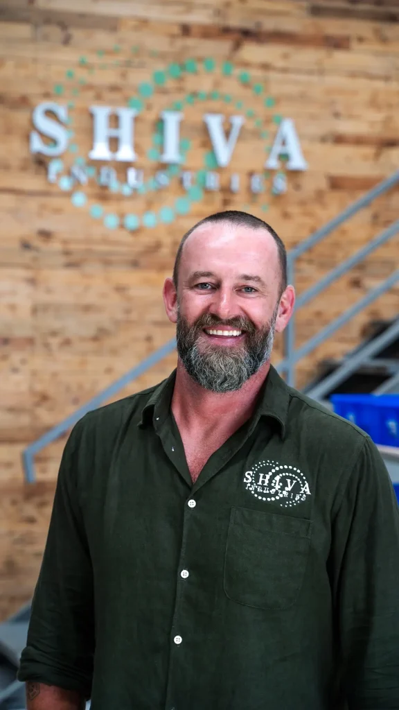 Tobias Wilson standing in front of the Shiva Industries organic waste processing facility in Bali, Indonesia.