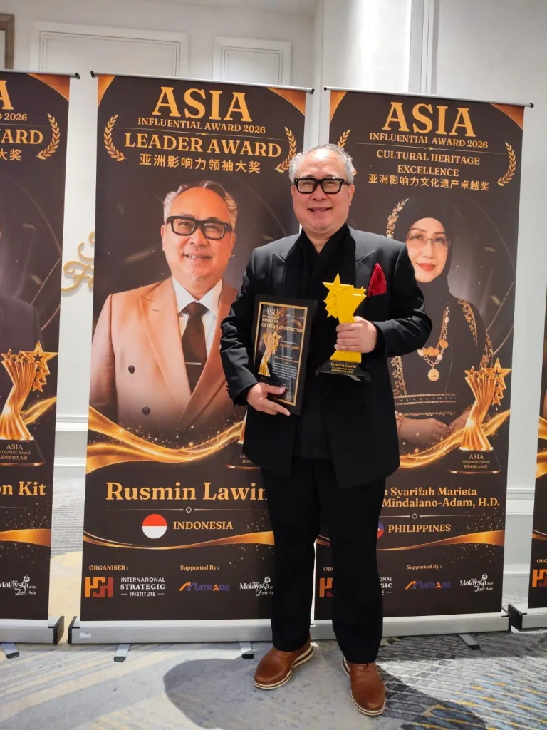 Rusmin Lawin holding the Asia Influential Award 2026 trophy after a 10,000-mile Pacific tour